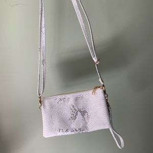 White and metallic snake skin cross body/wristlet